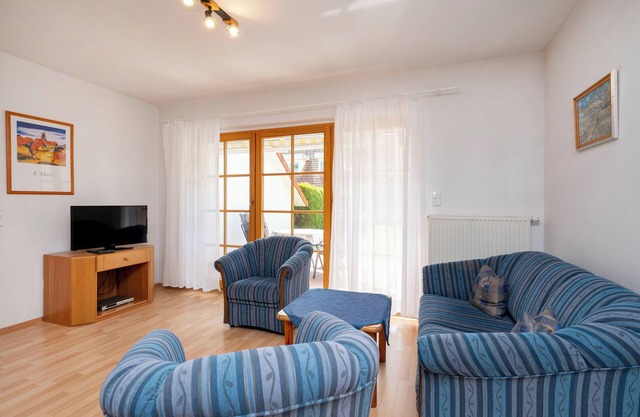 Comfortable terraced house in Zingst with garden, terrace and heated pool