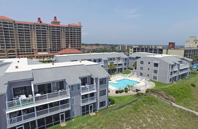 Condo near Golf w/WiFi, Balcony, Resort Pool, Grill, Water Sports & Fishing