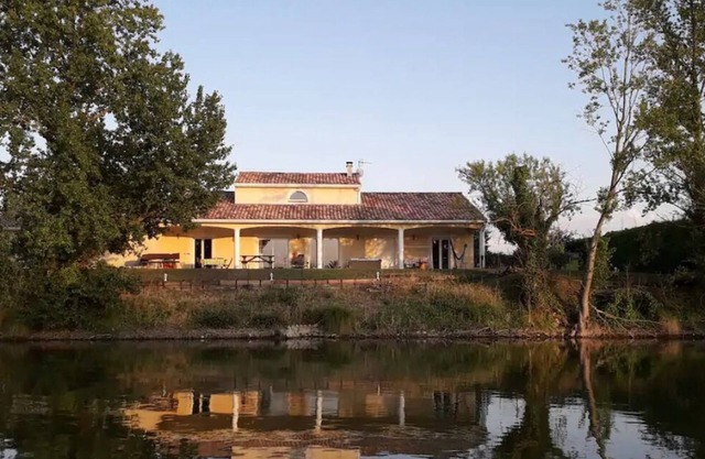 Contemporary house with heated swimming pool on the edge of a private lake. paradise