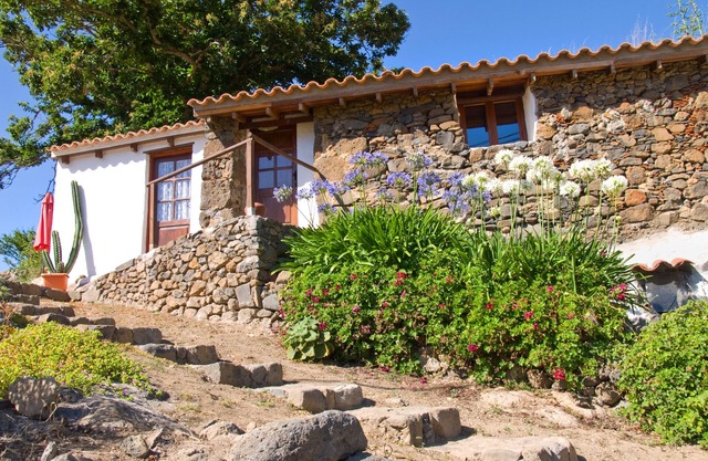 Cozy cottage with a garden in the middle of nature