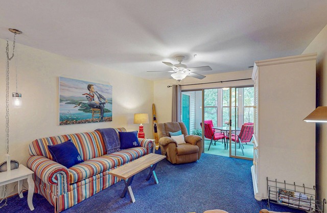 Cozy lakefront condo w/ two primary suites, sunroom & shared pool