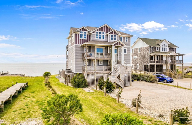 Dazzling waterfront home with balconies, private pool, hot tub, & game room