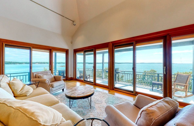 Delightful oceanfront home with amazing views, wrap-around deck & two fireplaces