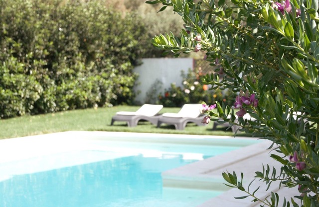 Detached Villa with private pool, few steps from the sandy beach, large garden.