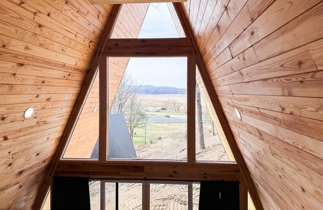 Dog-friendly A-frame cabin with loft, balcony, full kitchen, & washer/dryer