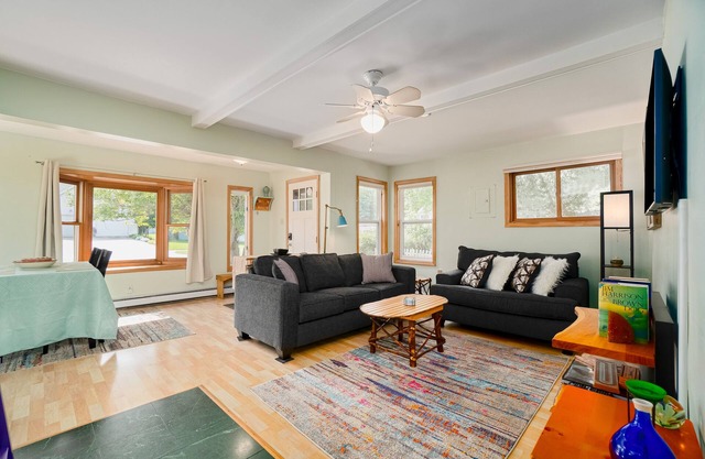 Dog-friendly cottage with fenced yard, firepit, W/D, & WiFi - walkable location