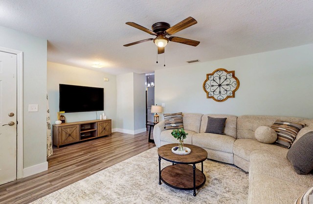 Dog-friendly home with a private pool, home theater, sunroom, & washer/dryer