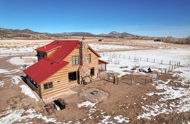 Dog-friendly riverfront retreat with hot tub, stunning views & screened porch