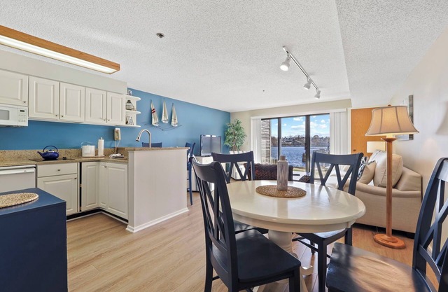 Edgewater Inn Condo #117D with Waterfront Access | Pool, Hot Tub, Sauna