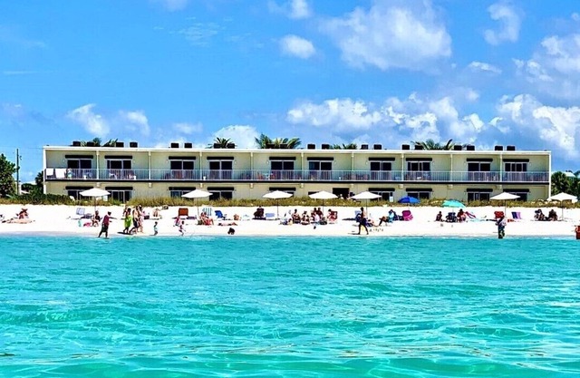 FALL INTO THE SEA from the porch of these one bedroom suites at Bali Hai Beachfront Resort