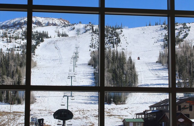 FRONT AND CENTER for 8! PANORAMIC VIEWS! Wall of windows facing slopes! GARAGE!