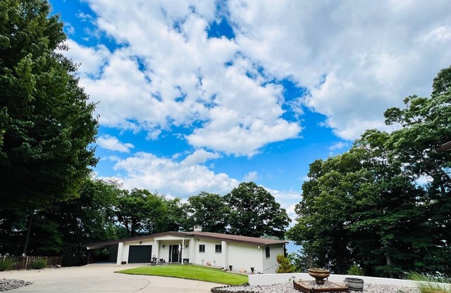 Gated home, right on the water, minutes from downtown Rogers!