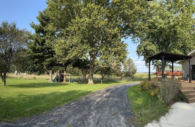 Gorgeous 10 acre farmhouse retreat-complete with outdoor entertainment space