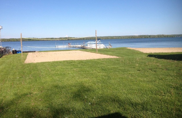 Gun Lake Vacation Rental, Sandy beach, docks, picnic tables, kids play grounds