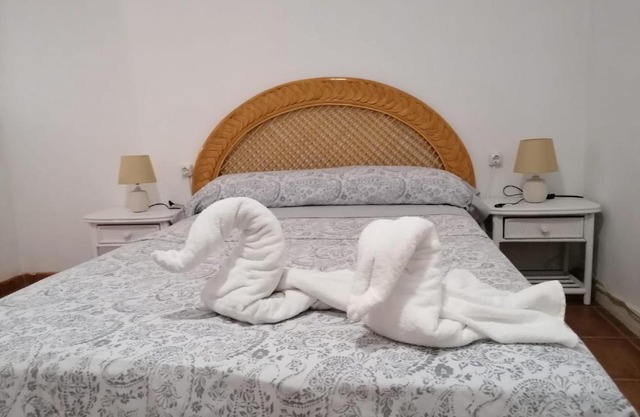 Habitación matrimonial en un bajo baño compartido Areas compartidas