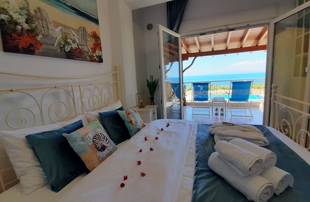 Halkidiki Blue Pastel, a cliff villa with wide sea view, and large shared pool