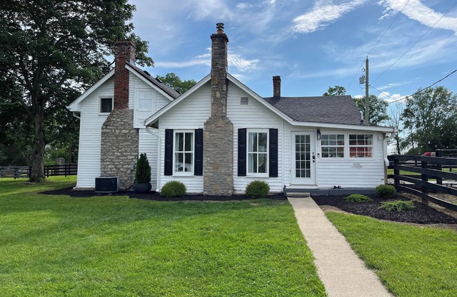 Historic circa 1790 2 bedroom farmhouse on 6 acres in beautiful Paris, Kentucky.