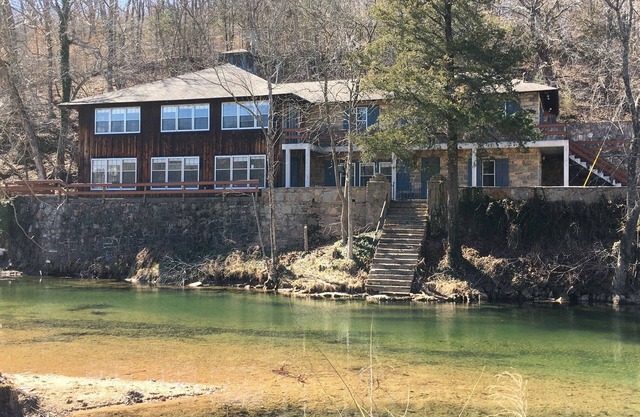 Historic Limestone House in park setting in Ozarks