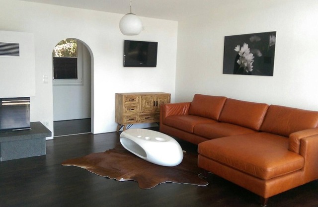 Holiday home on a south-facing wooded slope with lake view