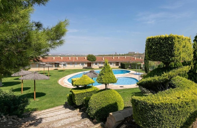 Holiday home with communal pool
