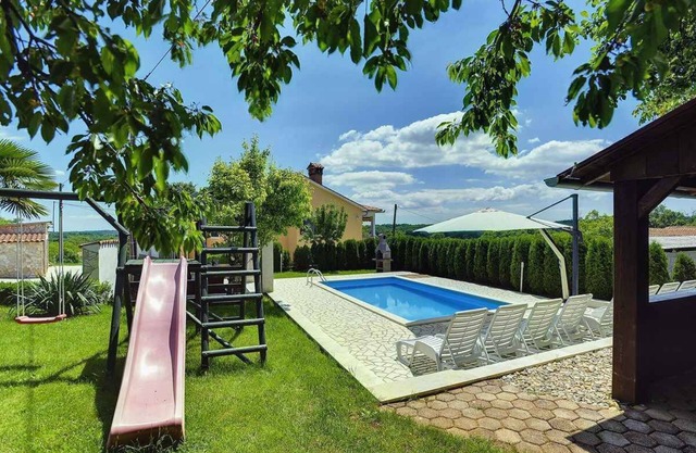 Holiday home with pool and air conditioning