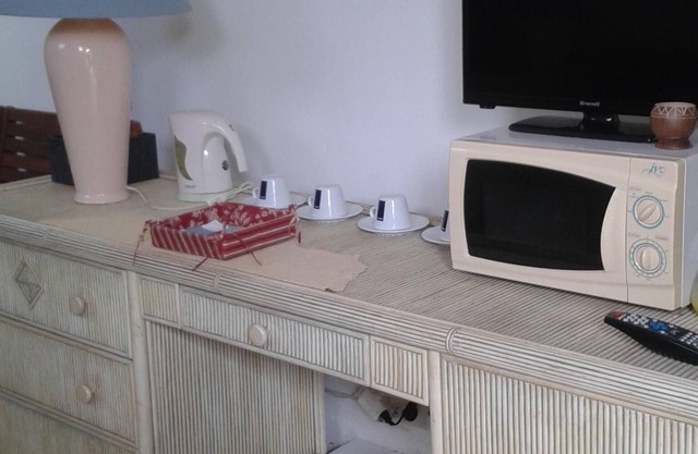 House of full foot with small done up and fenced yard.