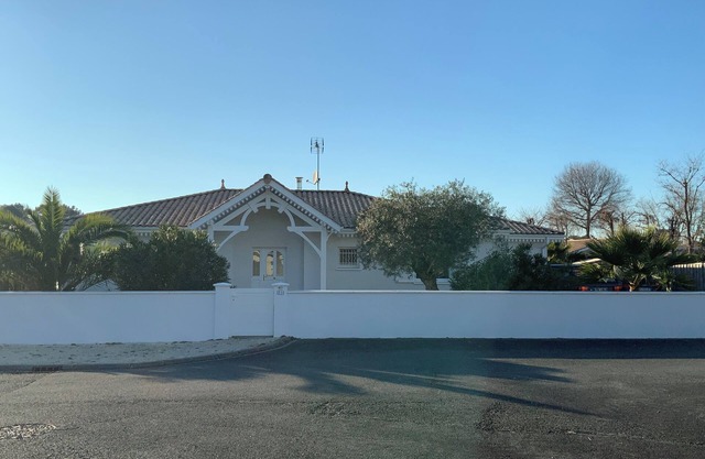 House with heated pool close to the ocean and shops.
