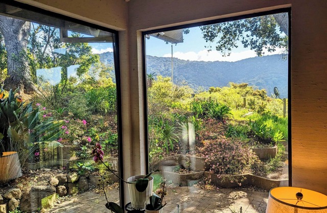 Huge, airy house with sweeping views, multiple patios, hot tub, car, and more!