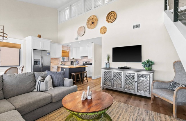 Ideally located beachfront home with balcony, washer/dryer, AC, & amazing views