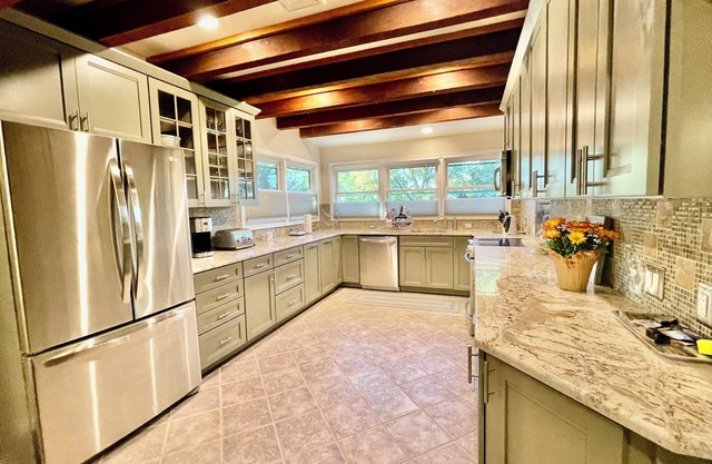 Just minutes to the beach with a hot tub and fire pit!