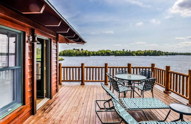 Lakefront home with large deck, gas grill, wood fireplace, heated pool, firepit