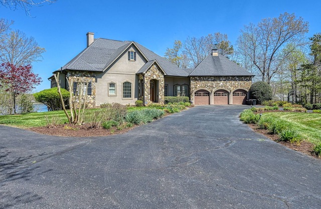 Lakefront stunner with pool, 50' waterslide, hot tub, & dock - dog-friendly