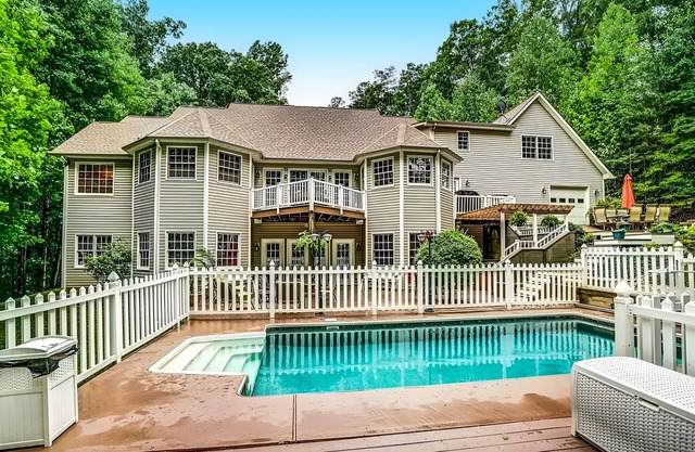 Lakefront with pool, hot tub, dock, SUPs, water carpet, billiards, foosball, gym