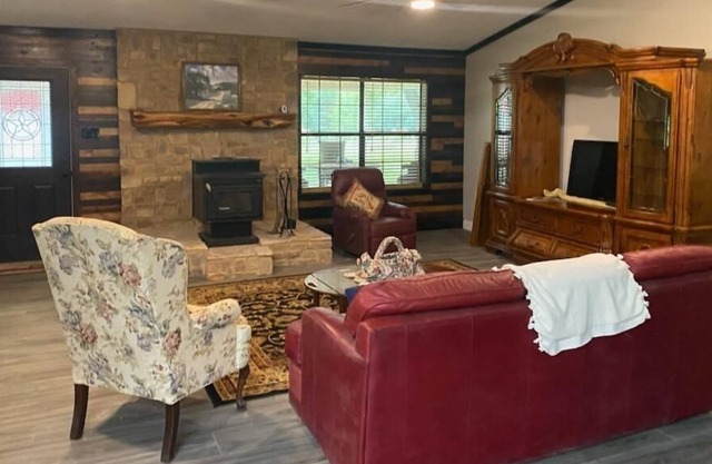 Large, open format farmhouse set back with 100 acres of prime hunting/fishing.