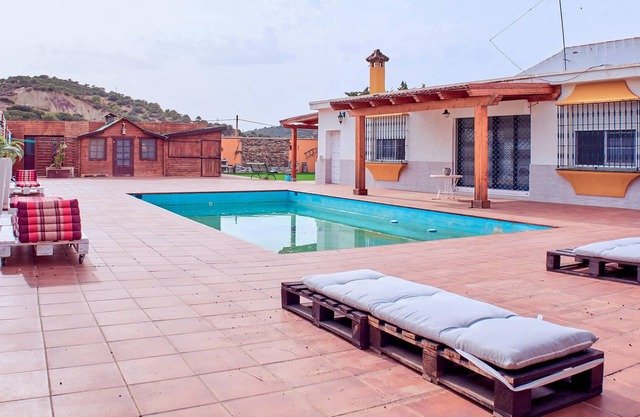Large property with swimming pool in spacious outdoor area.