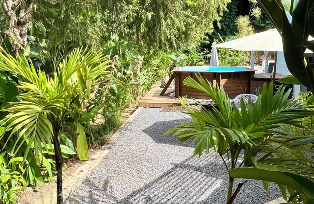 Les Vanilles Gite in lush tropical setting, swimming pool 800m from the beach.