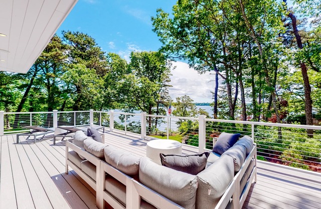 Luxe lakefront home on Follins Pond with private beach, amazing decks & yard