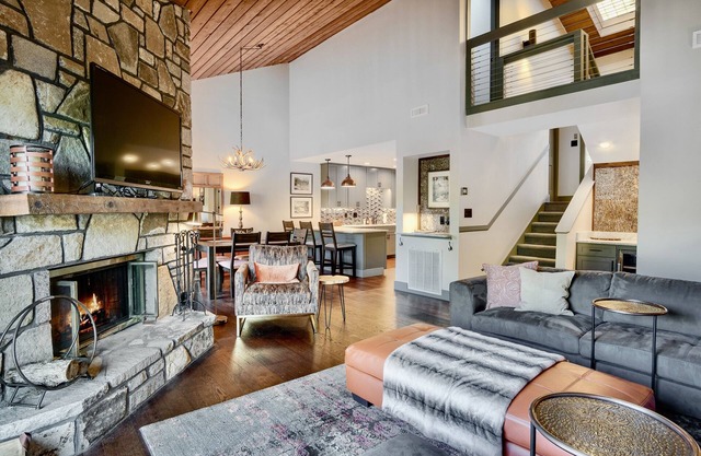 Luxury Lakefront Gem with vibrant fall foliage and panoramic lake views