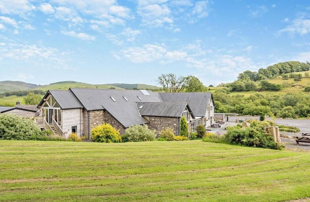 Luxury renovated barn with a large hot tub and games room. Located in the beautiful Welsh countryside with stunning scenery and great hiking trails. Pet and family friendly.