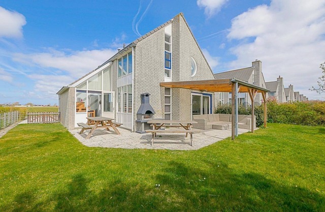 Luxury vacation home within walking distance of the beach with covered terrace: Villa Mooy