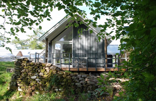 Luxury waterfall cottage with private hot tub at Loch Tay