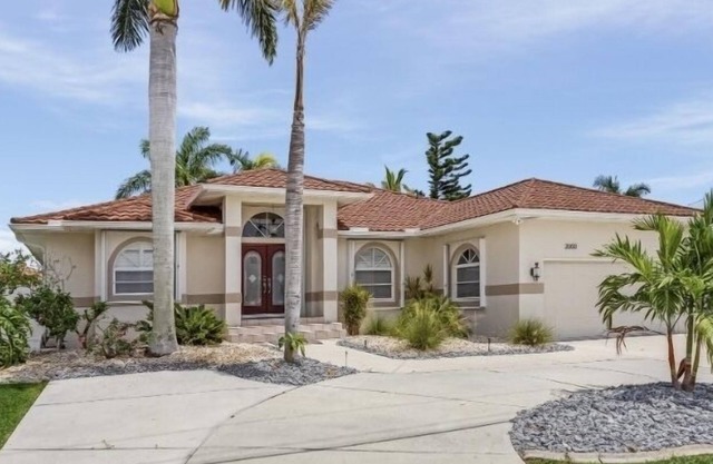 MAGNIFICENT! LUXURY WATERFRONT HOME;BIG HEATED POOL-80’ DOCK! 5 MIN FISH VILLAGE