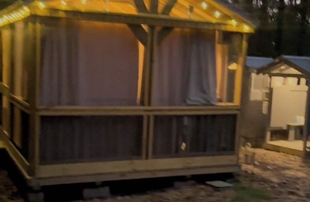 Mentone glamping getaway in a private screened in cabin in charming Mentone