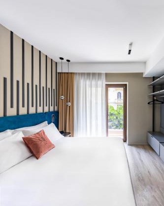 MH SUITES Plebiscito