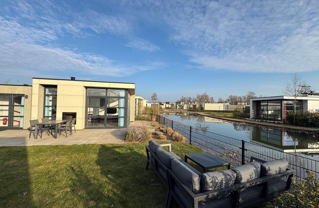 Modern Chalet with Fenced Garden, Boat Mooring, Sauna and Pool in Olburgen