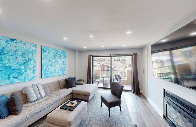 Modern condo with mountain views, walk-to-gondola access & cozy fireplace