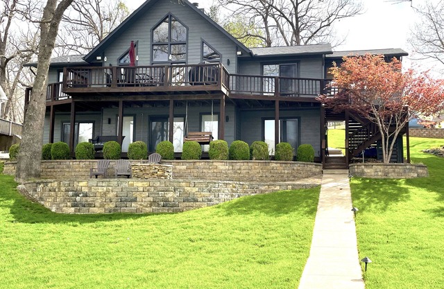 Modern lake home steps from calm water in a quiet cove.