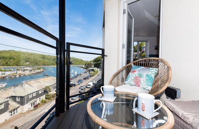 Modern town centre apartment with balcony and river views.