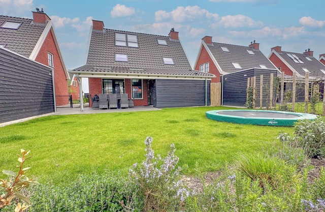 Modern villa with a sauna, hot tub, and a garden