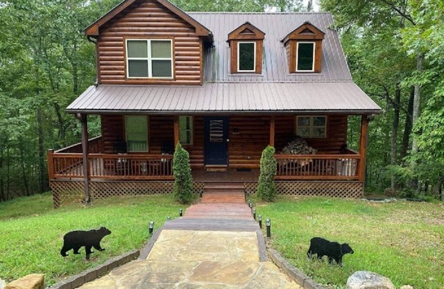 Mountain views located on private lake all wood 3 story cabin.